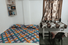 Twin-share student room at Alpesh Yoga, second view