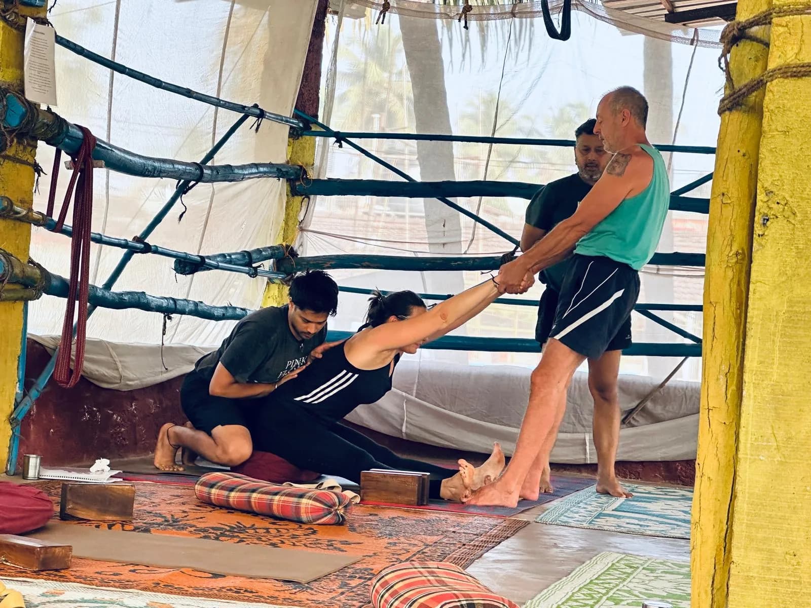 Trainees practising hands-on assists on each other while Alpesh Patwari supervises